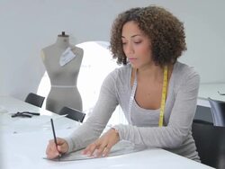 Fashion Designer working in studio Stock Footage