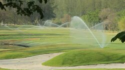Spinkling Grass Field. Stock Footage