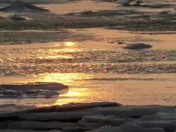 WS SLO MO Reflection of sunset on water of river / Churchill, Manitoba, Canada Stock Footage