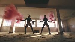 Sexy girls dancing with pink smoke bomb Stock Footage