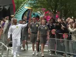 Lewis Hamilton is the first torch relay runner as Stock Footage