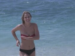 Woman Running Out of Ocean in Slow Motion Stock Footage