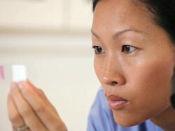"PAN medical lab technician looking in microscope/Richmond,Virginia, USA" Stock Footage