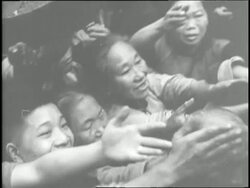 A crowd of people push and reach for food during a famine in China. News Clip