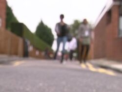 Parents walking their children to school News Clip