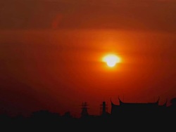 HD Timelapse:Sunset front of a temple roof.(zoom in) Stock Footage