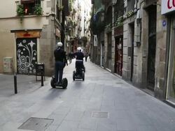 Jewish quarter, tourists riding on segways, Barcelona Stock Footage