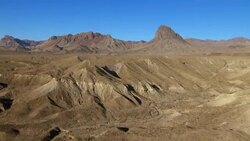 Flying over Big Bend desert towards the Sierra Quemadas and their landmark, Elephant Tusk. Stock Footage