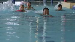 Children Swimming in a Pool at a Fitness Centre Stock Footage