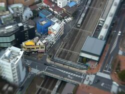 High elevation view of Tokyo city showing modes of transport using Lensbaby, Japan, Asia Stock Footage