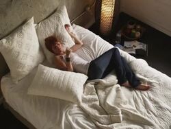 WS HA Young woman lying on bed, Salt Lake City, Utah, USA Stock Footage