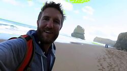 Young man takes a selfie portrait on Gibsons steps beach Stock Footage