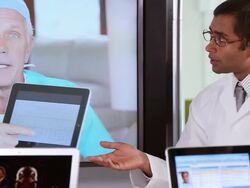 CU Medical Workers Discussing Patient Information with Doctors Using Video Conference / Richmond, Virginia, USA Stock Footage