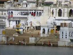 People Bathing in Lake at Pushkar India Stock Footage