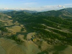 Aerial wide shot of the Crazy Mountains near Bozeman, MT in autumn Stock Footage