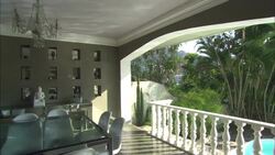 Light reflections from a swimming pool dance on the ceiling of a covered balcony at La Maison Hotel in Rio de Janeiro. Stock Footage