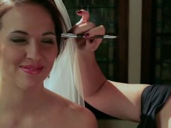 Bridesmaids and mother help bride with makeup Stock Footage