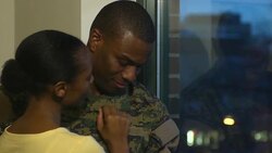 Military Husband and Wife Embrace by the Window Stock Footage