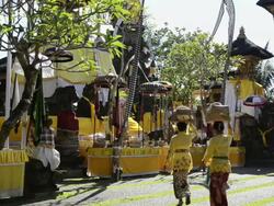 MS Shot of Two women carrying offerings on her head into Pura Dalem Puri temple / Ubud, Bali, Indonesia Stock Footage