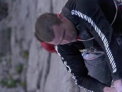 CU SLO MO Shot of male climber struggling to get fingers in crack / Estes Park, Colorado, United States Stock Footage