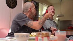 Father feeding disabled son Stock Footage