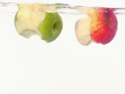 bitten apples falling into the water Stock Footage