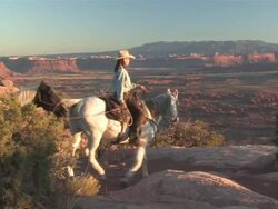  MS Women Riding Horses into Spectaculair Red Rock Mountains, Majestic Western Landscapes at sunset / Telluride, Colorado, United States  Stock Footage