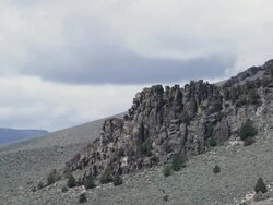 "WS T/L View of clouds rolling over rocky lava on mountain in high desert of Central Oregon / Bend, Oregon, United States " Stock Footage