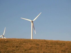 Wind turbines on a hilltop Stock Footage