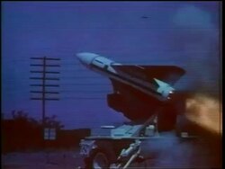 1960s missile blasting off diagonally (night?) / Cold War / documentary Stock Footage