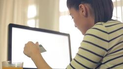 Young woman doing online shopping at home using her credit card. Stock Footage