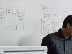 MS PAN designer in high tech office discussing project Stock Footage