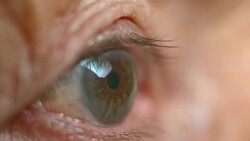 ECU Senior person opening brown eye Stock Footage