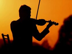 HD: Silhouette Of A Violinist At Sunset Stock Footage