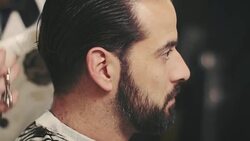 Barber cutting a mans hair Stock Footage