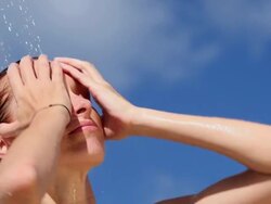 Close Up of Woman taking outdoor Beach Shower Stock Footage