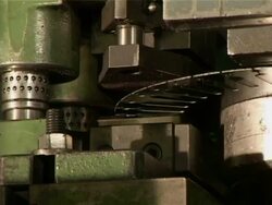 Industrial machine punching holes in metal Stock Footage
