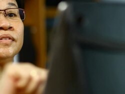 Woman using Touch Screen Tablet Stock Footage