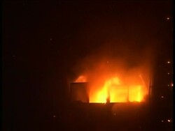 China's state broadcaster says the pyrotechnics that set fire to a new luxury hotel, gutting the structure and killing a firefighter, were so powerful that a special permit was needed, but it was never obtained. News Clip