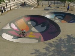 Trick cyclist in colorful skatepark,lyons,WS Stock Footage