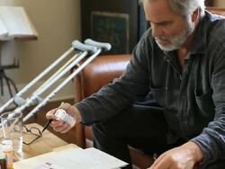 Middle aged man overwhelmed by medical bills Stock Footage