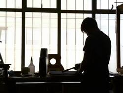 Craftsman 'Luthier' Nigel Forster making hand made Guitars Stock Footage