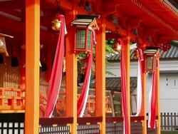 MS Shot of many Japanese Shinto shrine style Suzu with large bells hung over entrance of shrine / Fushimi ku, Kyoto, Japan. Stock Footage
