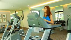 Beautiful woman running on treadmill Stock Footage