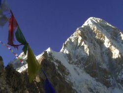Buddhist prayer flags on a ridge with Everest in the background. Stock Footage