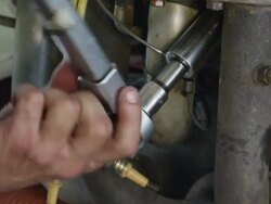 ECU hand of mechanic tightening bolt with a ratchet wrench, RED R3D 4K Stock Footage