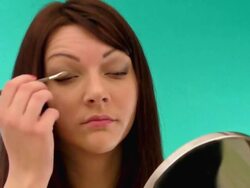 Girl applying makeup Stock Footage