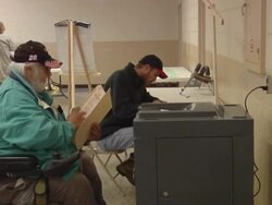 MS, PAN, Man in wheelchair casting his vote in ballot box, St. Marys, Ohio, USA Stock Footage