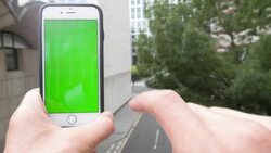 Man swiping a smartphone with a green screen Stock Footage