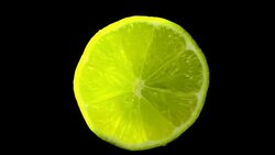 Lime fruit slowly rotating with black background Stock Footage
